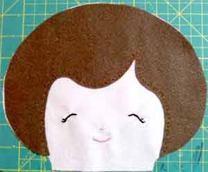 sewing the doll's face